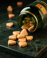 Geroprotect Essentials II orange tablets spilling from the bottle
